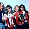 Metallica Portrait Session ROYAL OAK, MI - FEBRUARY 1: (L-R) Bass guitarist Cliff Burton (1962-1986), drummer Lars Ulrich, vocals, guitarist James Hetfield and guitarist Kirk Hammett pose for a studio portrait during the Ride the Lightning Tour at the Royal Oak Music Theatre on February 1, 1985, in Royal Oak, Michigan. (Photo by Ross Marino/Getty Images)